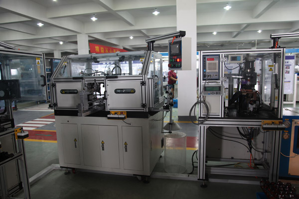 Winding machine and spot welder